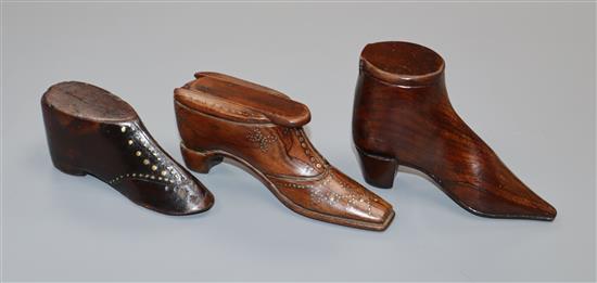 Two treen snuff shoes and a model shoe